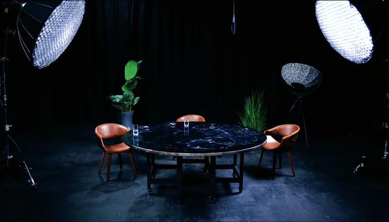 Roundtable podcast set in London at Finchley Studios – modern dark aesthetic for premium podcast episodes and group discussions up to 8 guests